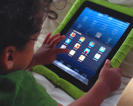 Young child glued to an iPad